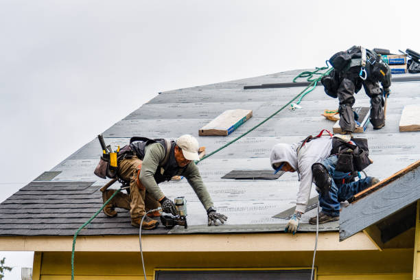 Professional Roofing technician working in Rossville, MD